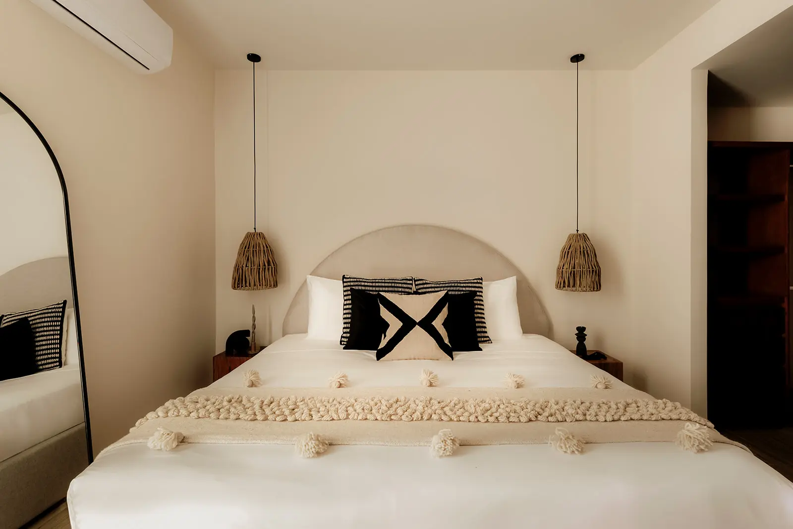 Stylish bedroom with designer furnishings at Samsara Tulum