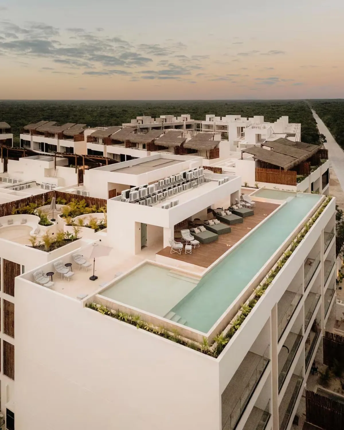 Aerial view of Samsara Tulum rooftop pools and jungle surroundings